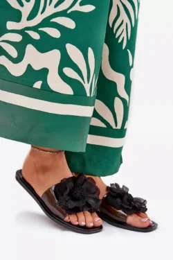 Skaidrios plokščiapadės moteriškos šlepetės su dirbtine gėle juodos Vobetta